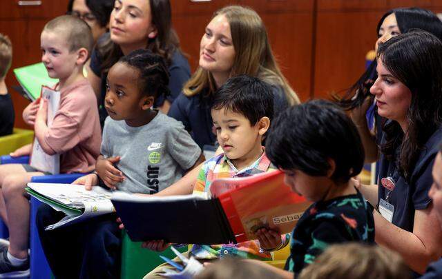 Student clinicians and children follow along with circle time during an early communication, language and social skills program at the Callier Center in Dallas on Thursday, March 5, 2026.